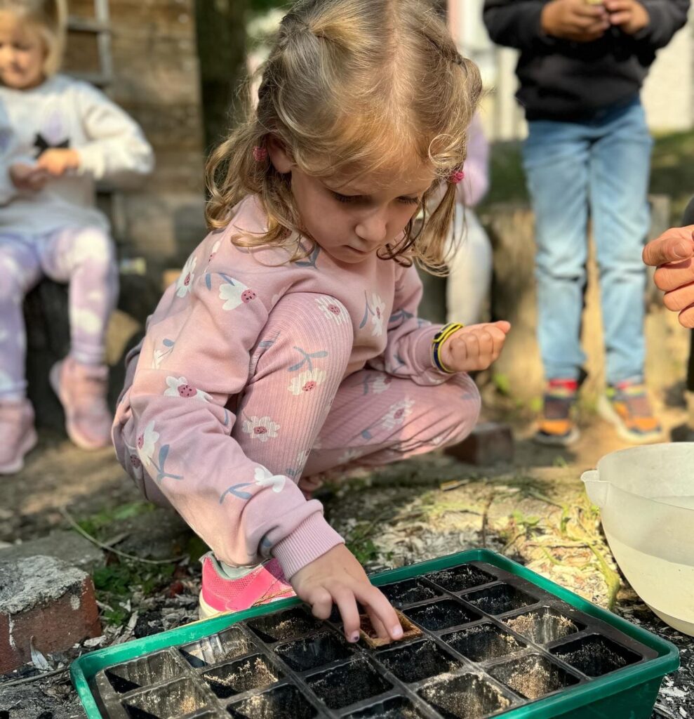 Student planting seeds