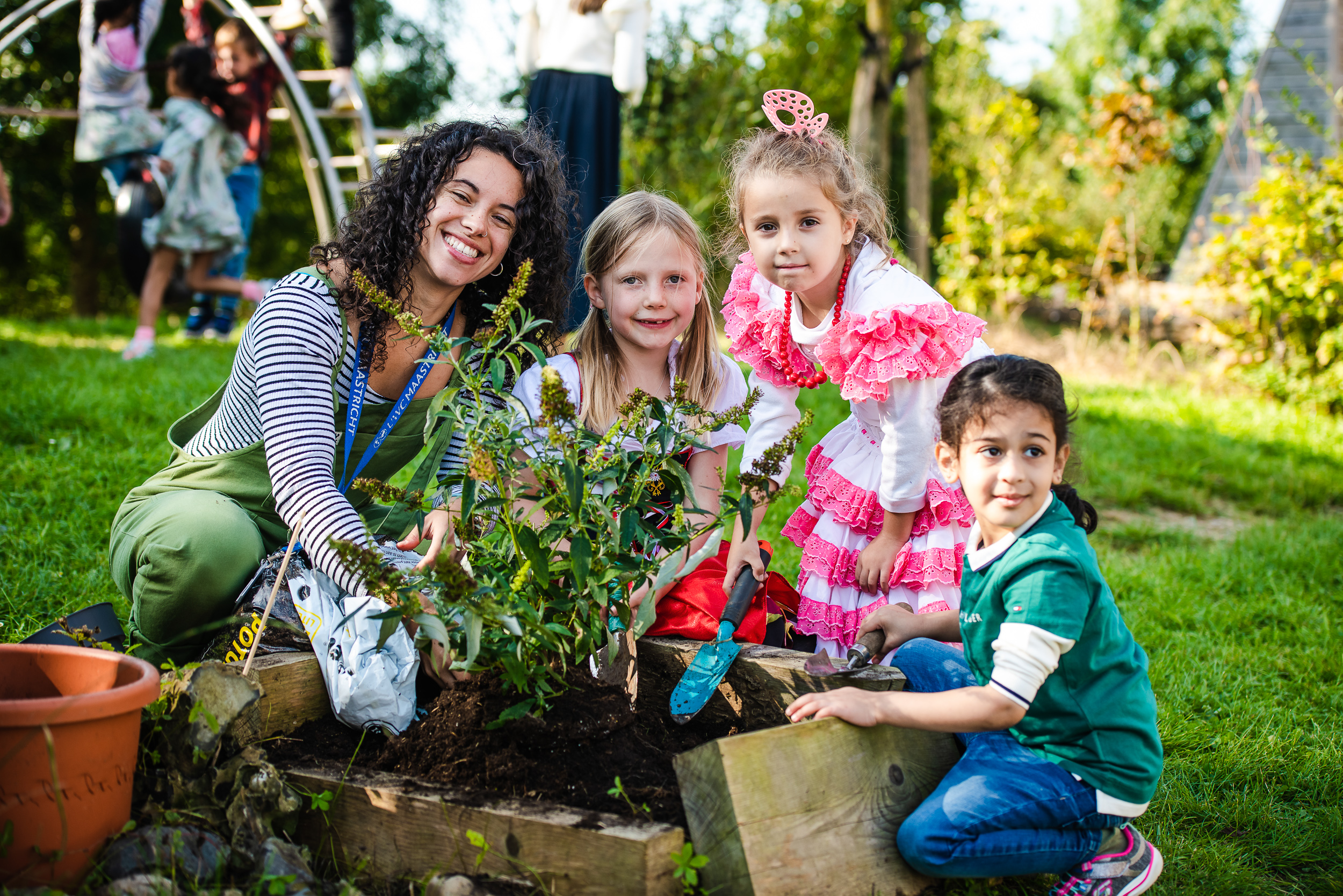 Teacher with students in garden