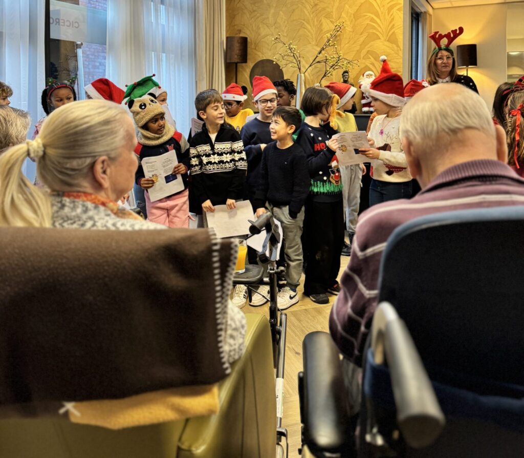 Primary kids singing Christmas carols to a local elderly community.