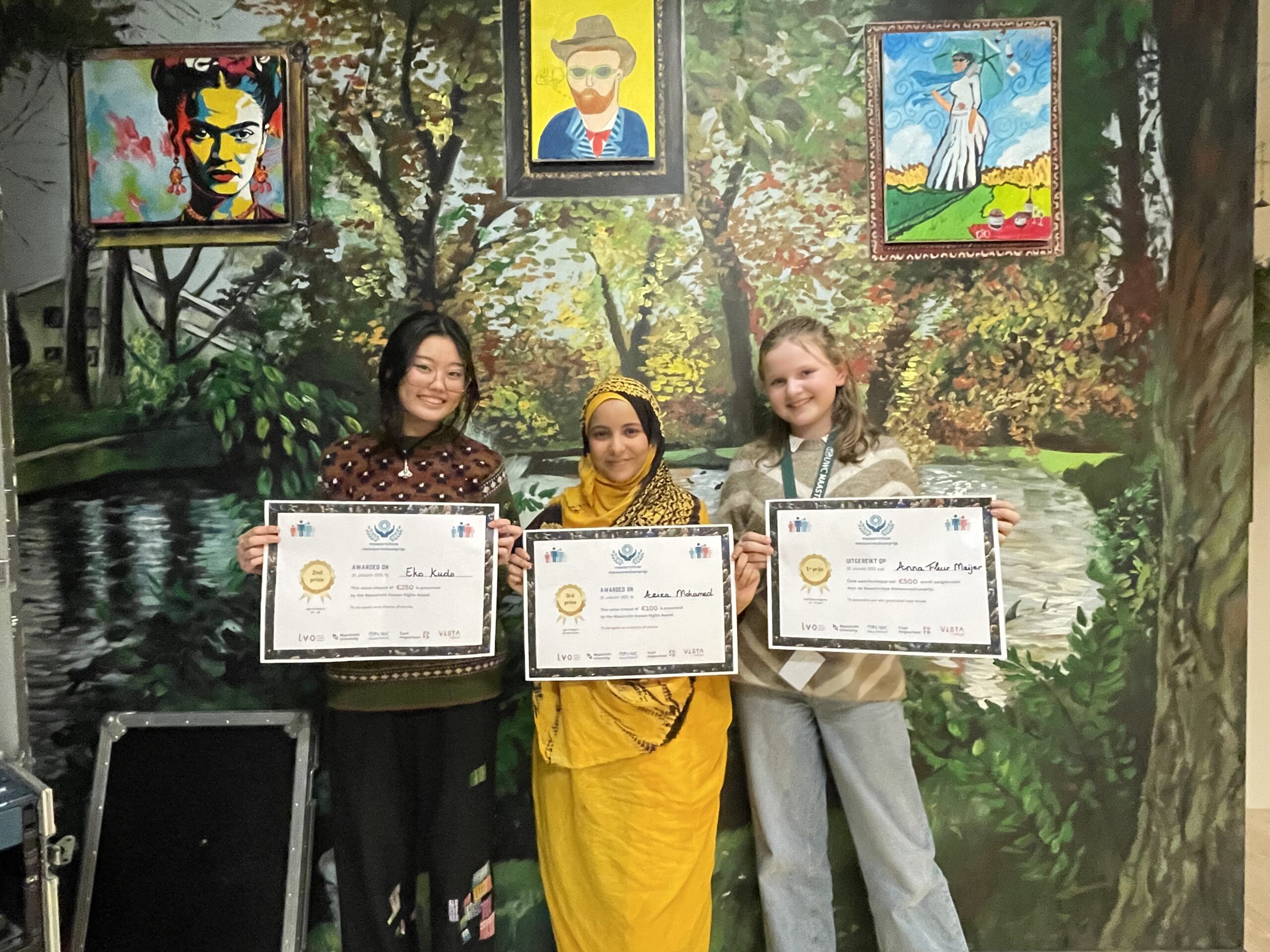 Students holding their prizes