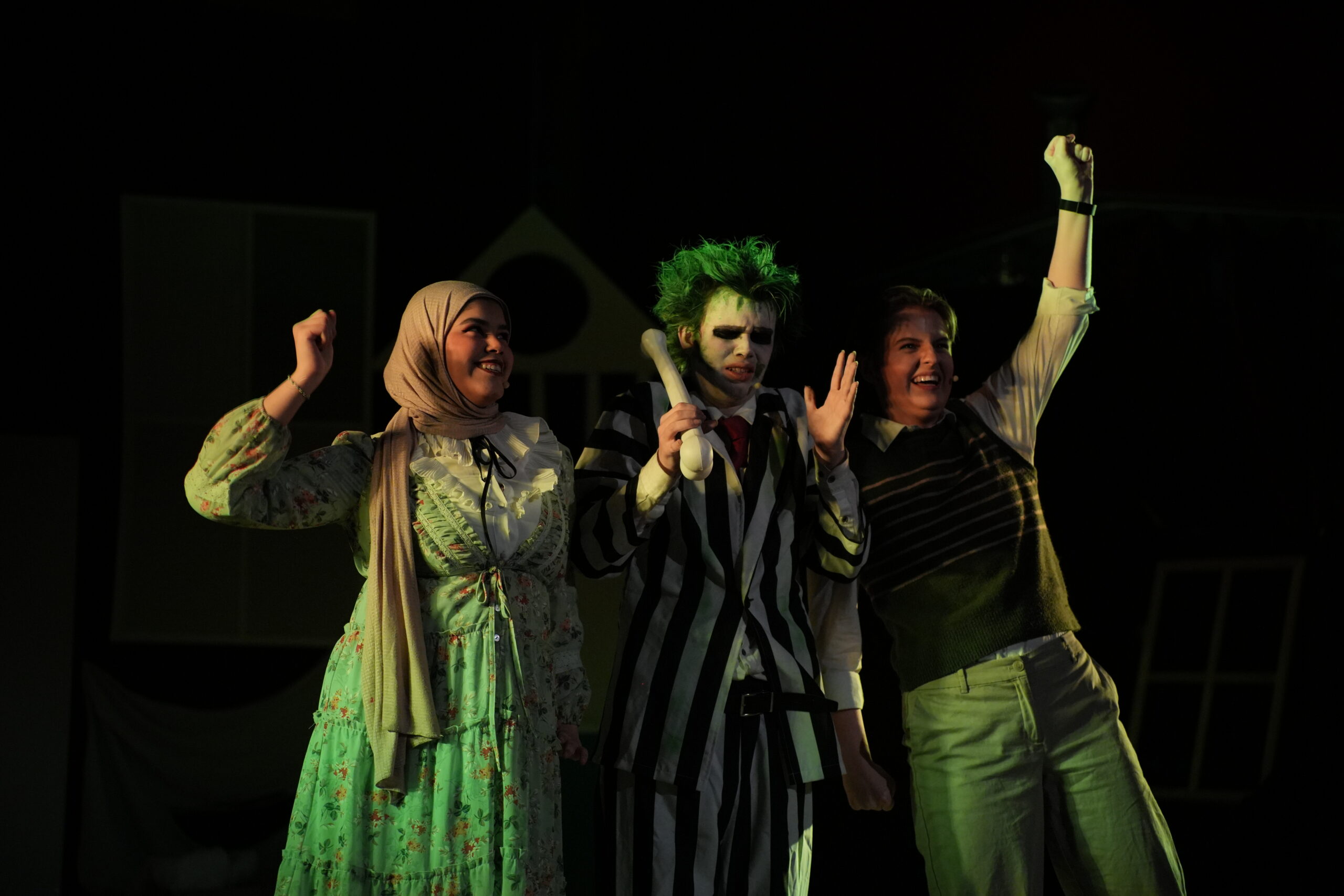 3 Students on stage acting for Beetlejuice